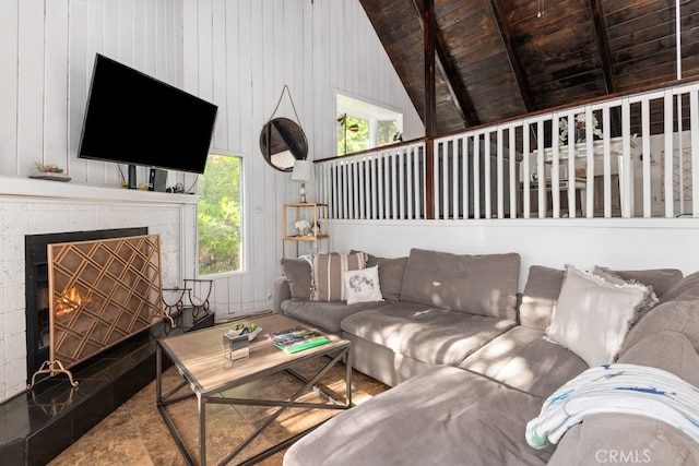 living room with wood ceiling, beam ceiling, and high vaulted ceiling