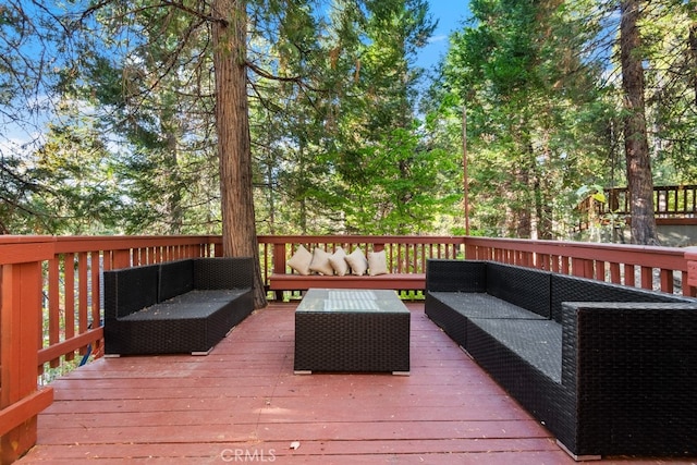 wooden terrace with outdoor lounge area