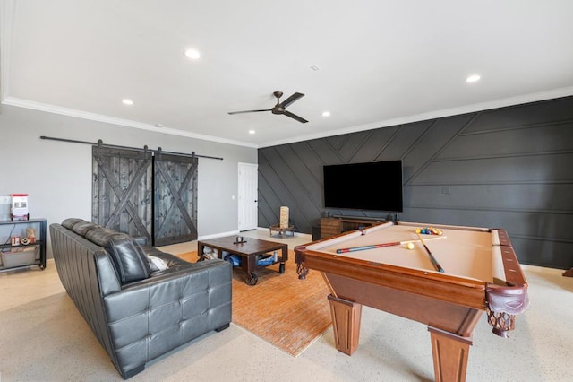 playroom featuring a barn door, ceiling fan, ornamental molding, and billiards