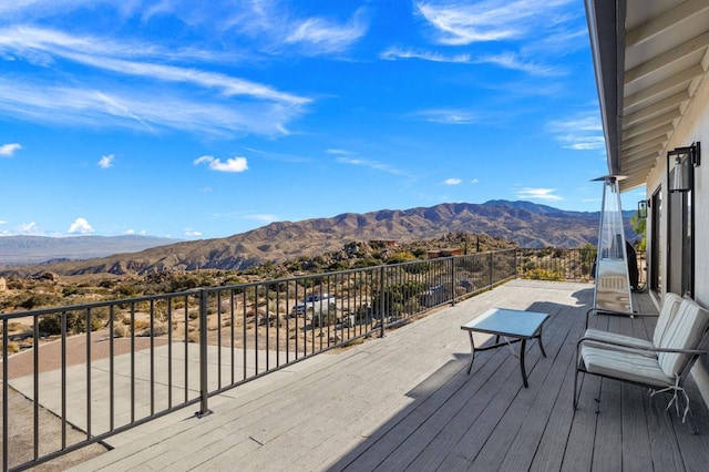 wooden deck featuring a mountain view