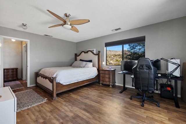 bedroom with hardwood / wood-style flooring and ceiling fan