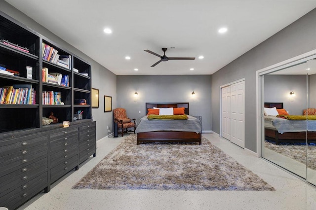 bedroom featuring ceiling fan and multiple closets