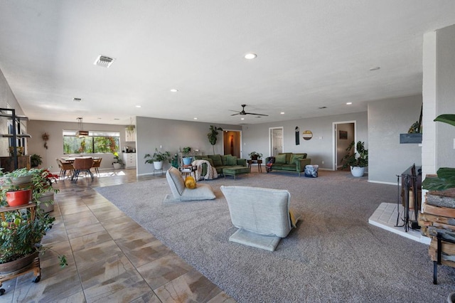 living room featuring ceiling fan and carpet floors