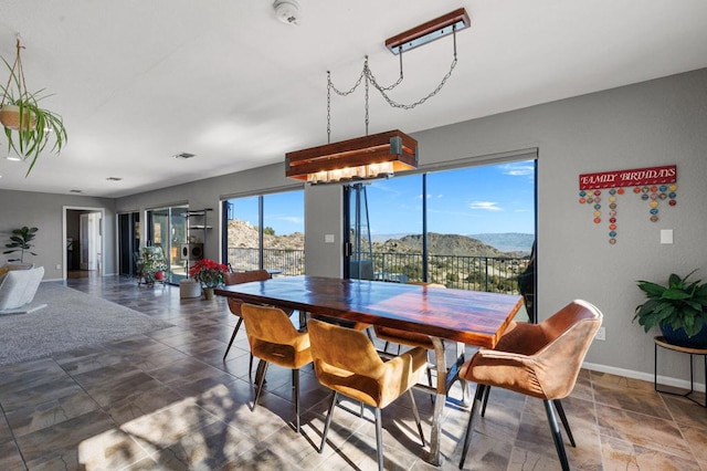 dining area featuring a mountain view