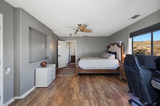 bedroom with hardwood / wood-style flooring and ceiling fan