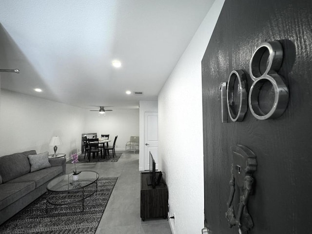 living room with ceiling fan