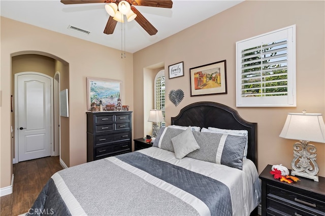 bedroom with ceiling fan and dark hardwood / wood-style flooring