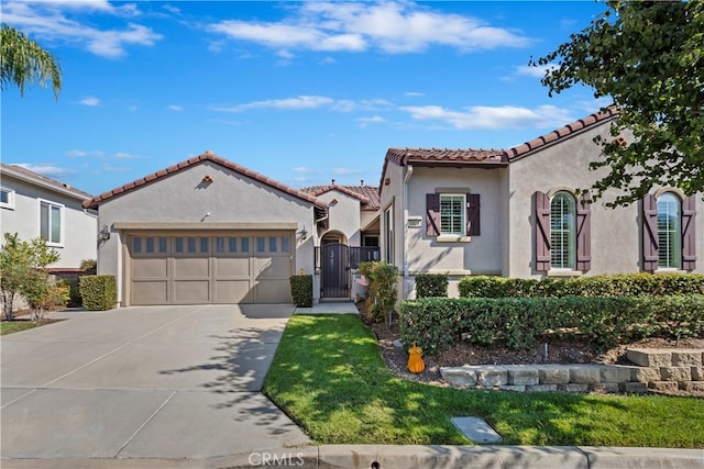 mediterranean / spanish home featuring a garage