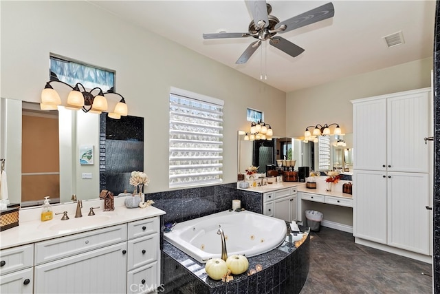 bathroom featuring ceiling fan, vanity, tiled bath, and tile patterned flooring