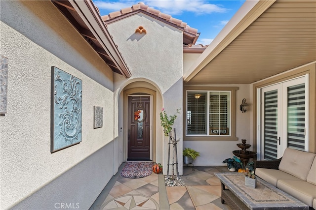 doorway to property featuring a patio area