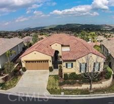 mediterranean / spanish house featuring a garage