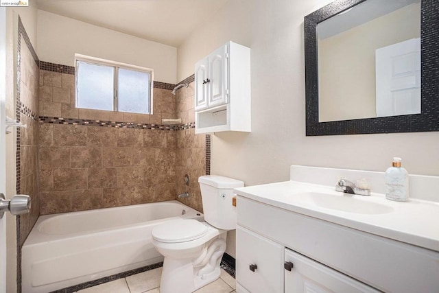 full bathroom featuring toilet, vanity, tile patterned floors, and tiled shower / bath