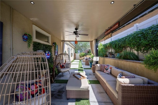 view of patio with outdoor lounge area and ceiling fan