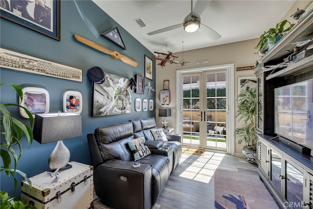 interior space featuring ceiling fan, french doors, and hardwood / wood-style floors