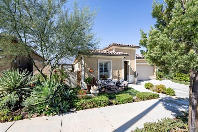 mediterranean / spanish home featuring a garage