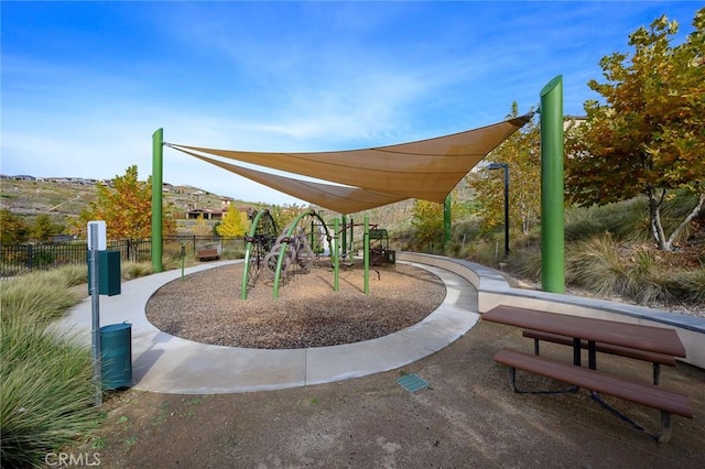 view of property's community featuring a playground