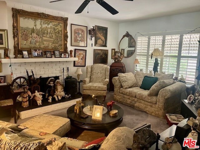 interior space featuring a brick fireplace and ceiling fan