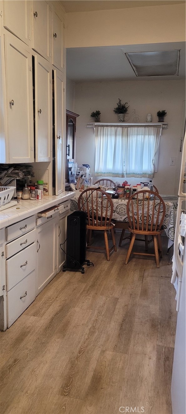 dining area with light hardwood / wood-style flooring