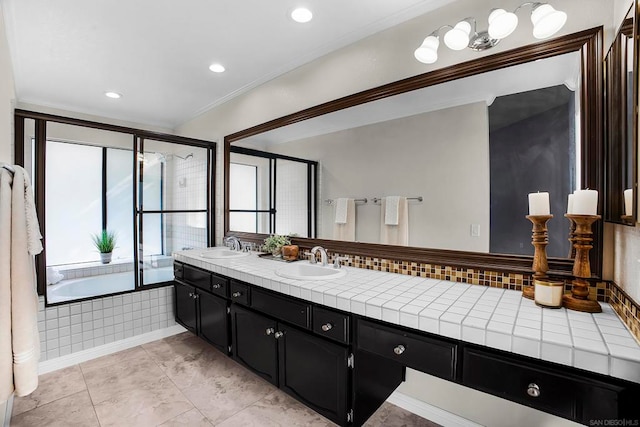 bathroom featuring ornamental molding, shower with separate bathtub, tile patterned floors, and vanity