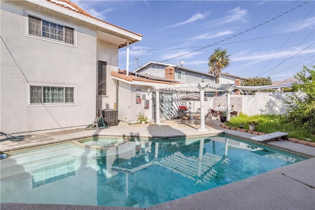 view of pool with a pergola, a diving board, cooling unit, and a patio