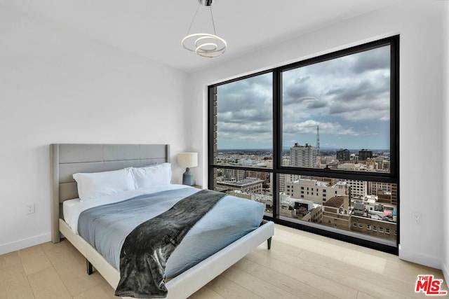 bedroom with light wood-type flooring