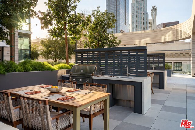 view of patio featuring grilling area and sink