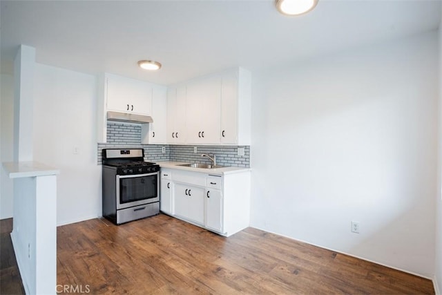 kitchen featuring white cabinetry, sink, stainless steel range with gas cooktop, dark hardwood / wood-style flooring, and decorative backsplash