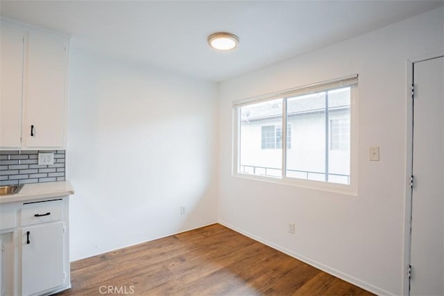 unfurnished dining area with light wood-type flooring