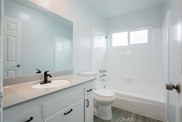 full bathroom with wood-type flooring, vanity, toilet, and shower / bathtub combination