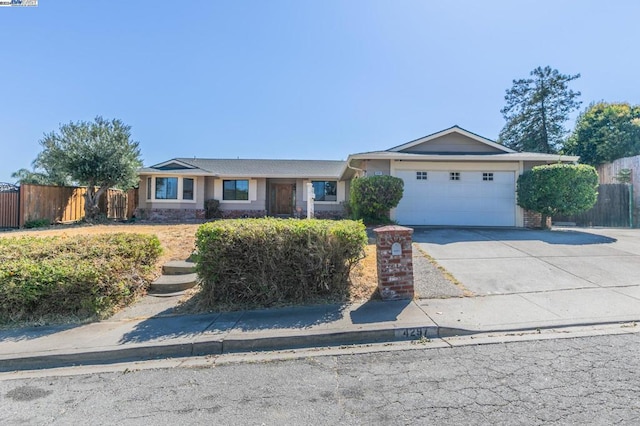 single story home featuring a garage