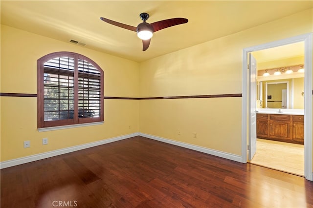 empty room featuring wood-type flooring and ceiling fan