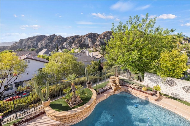 view of pool with a mountain view