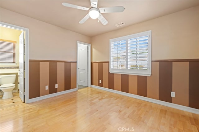 unfurnished room featuring wood-type flooring and ceiling fan