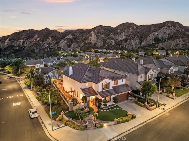 aerial view at dusk with a mountain view