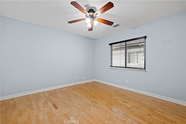 unfurnished room with ceiling fan and light hardwood / wood-style floors