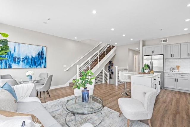 living room with light hardwood / wood-style floors