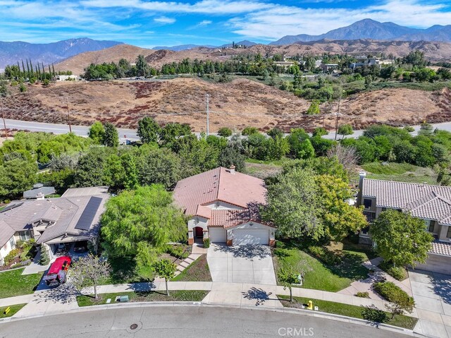 birds eye view of property with a mountain view