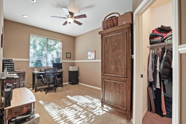 office with light colored carpet and ceiling fan