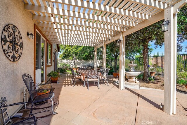 view of patio featuring a pergola