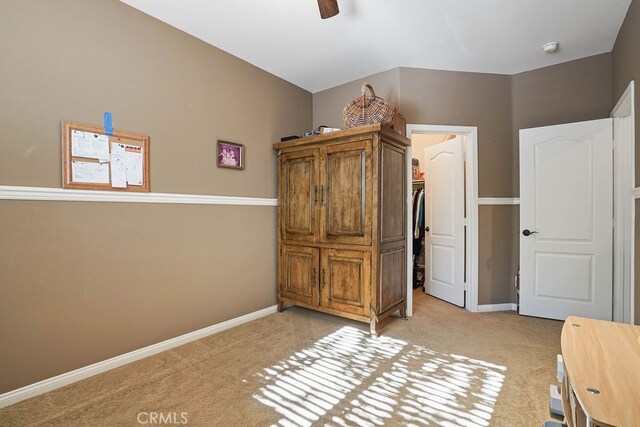 unfurnished bedroom featuring ceiling fan and light colored carpet