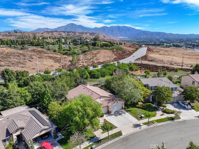 birds eye view of property featuring a mountain view