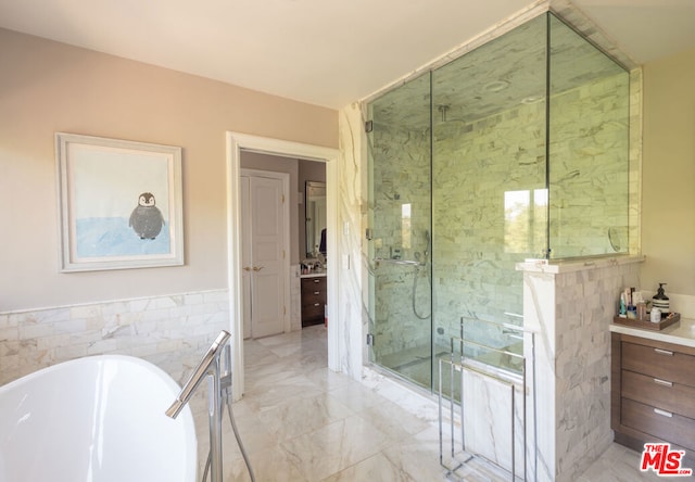 bathroom featuring vanity and plus walk in shower