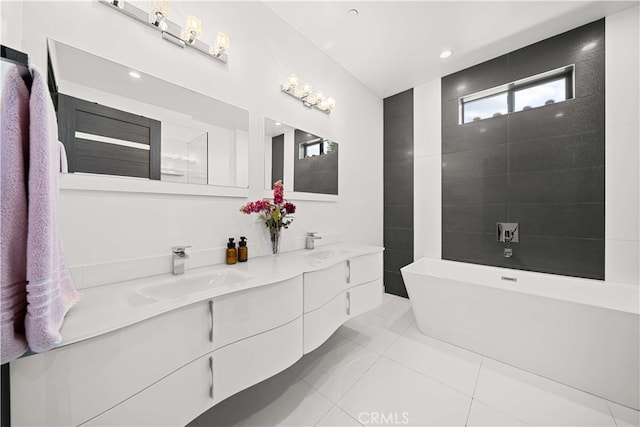 bathroom with vanity, a tub to relax in, and tile patterned floors