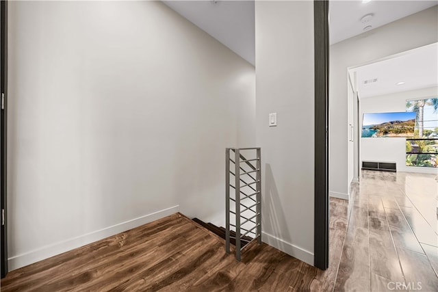 hallway featuring hardwood / wood-style flooring