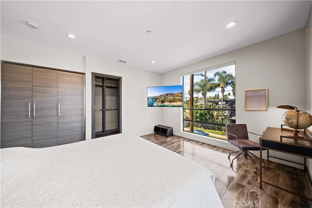 bedroom with wood-type flooring