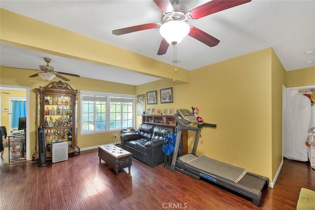 living room featuring hardwood / wood-style floors and ceiling fan