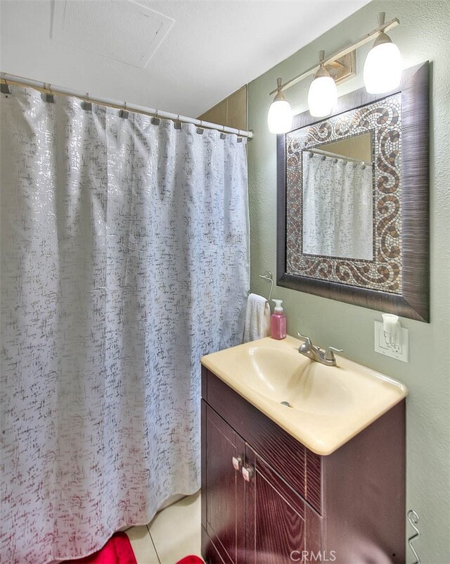 bathroom with vanity and tile patterned flooring