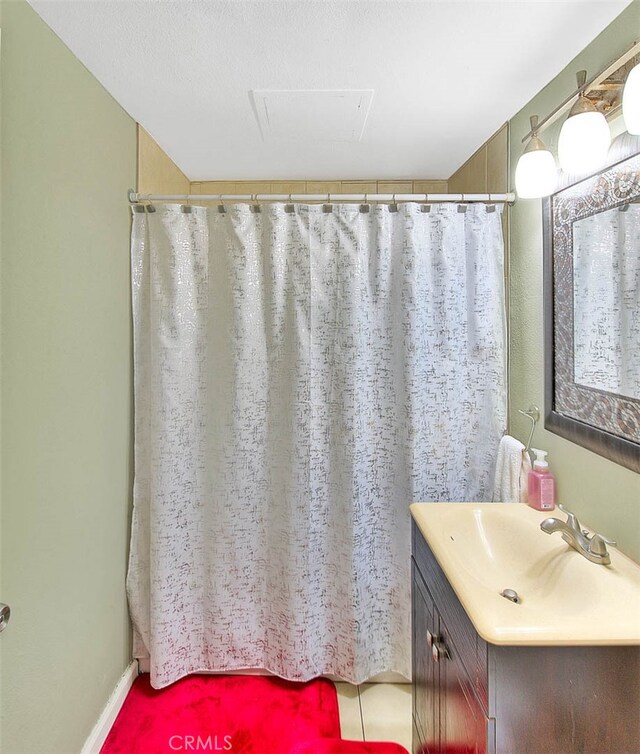 bathroom with vanity and a shower with curtain