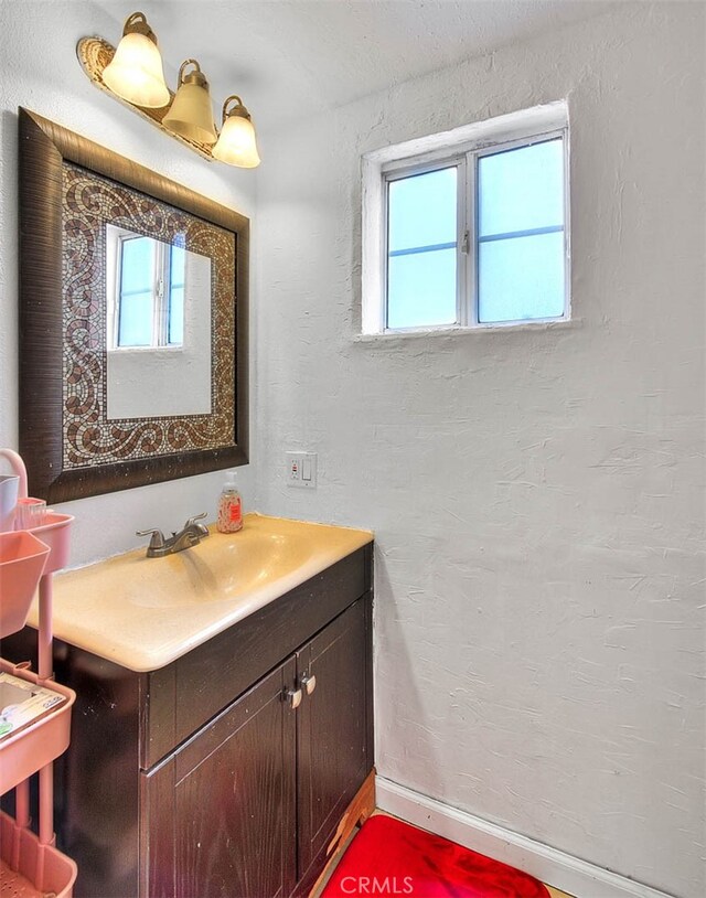 bathroom featuring vanity and a healthy amount of sunlight