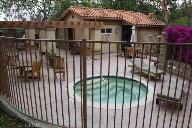 view of gate with a patio and fence